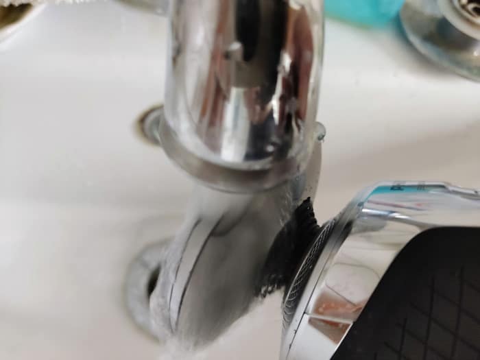 cleaning a Phillips S9000 prestige shaver head under the tap