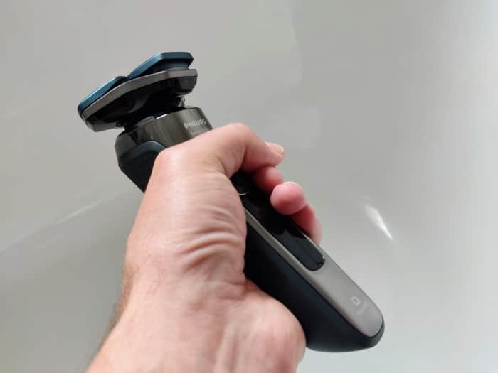 holding a Philips 7000 series shaver in hand