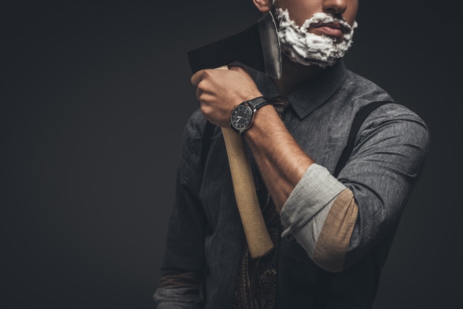 man with axe shaving showing an alternative to shaving cream