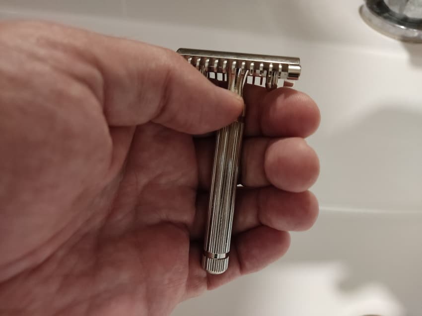 FaTip Piccolo in hand dispalying the size of the razor