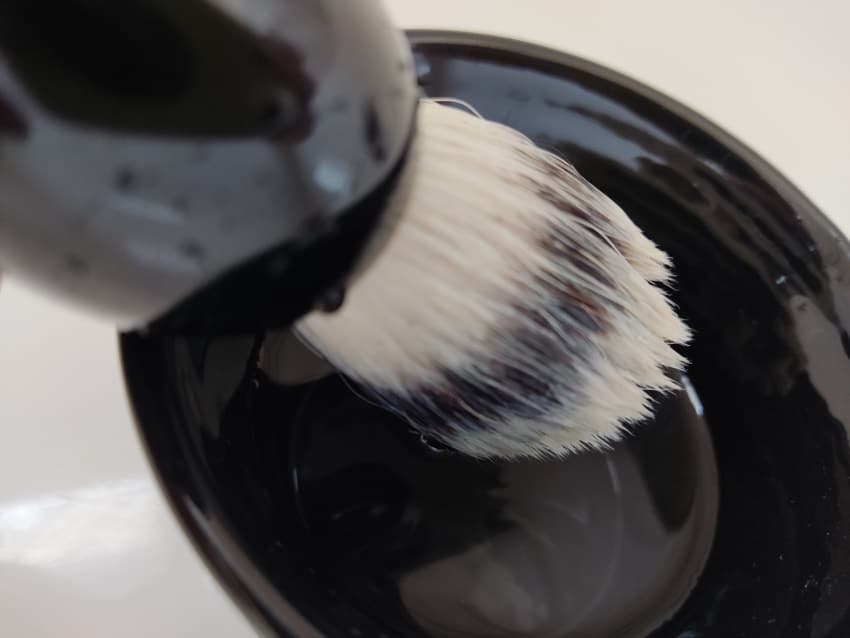 close up of MÜHLE Classic Silvertip Fiber Brush in shaving bowl with water