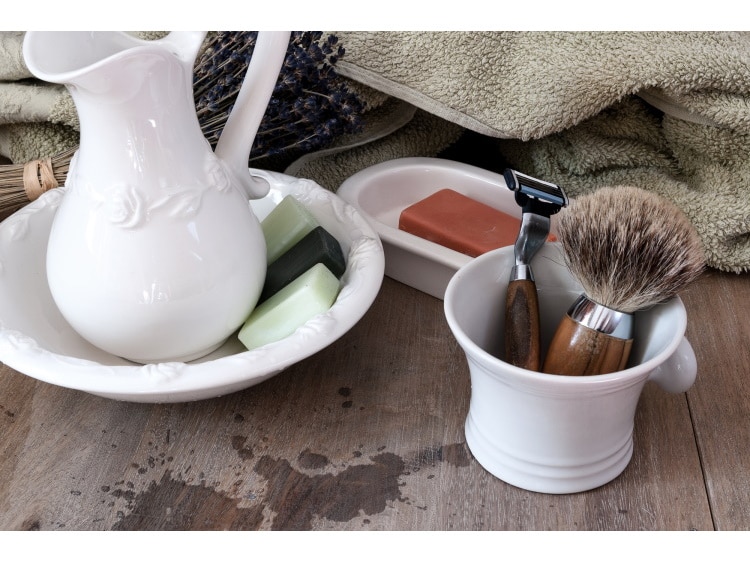 white shaving bowl mug with brush and razor inside