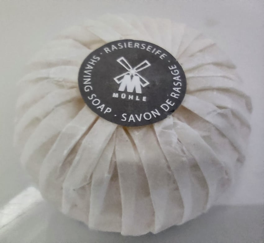 close up of MÜHLE Sandalwood Shaving Soap in packet