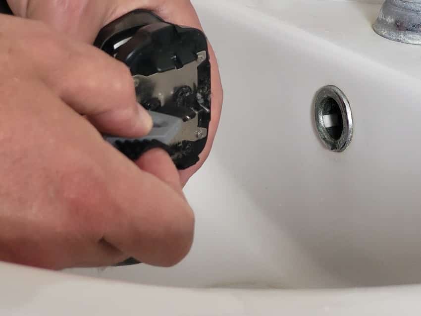 close up of cleaning inside Panasonic Arc 6 shaver