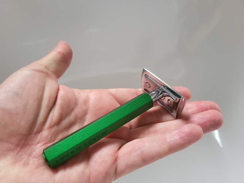 placing Muhle Hexagon Safety razor on hand to represent its size