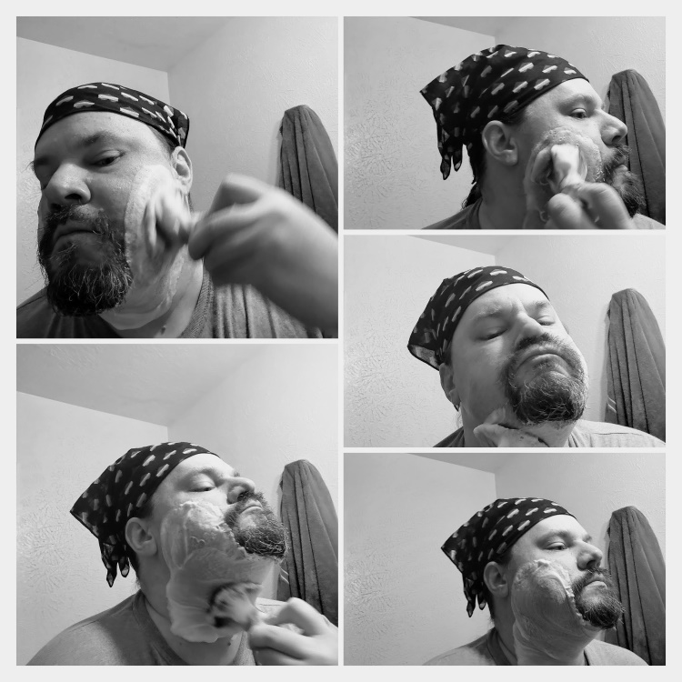 author Robert lathering classic shaving soap on his face with shaving brush