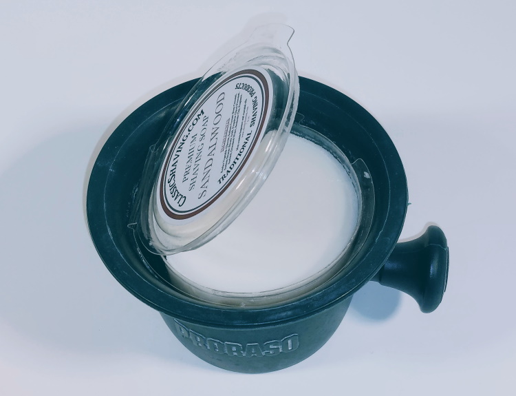 classic shaving sandalwood soap in a proraso shaving mug with the lid open