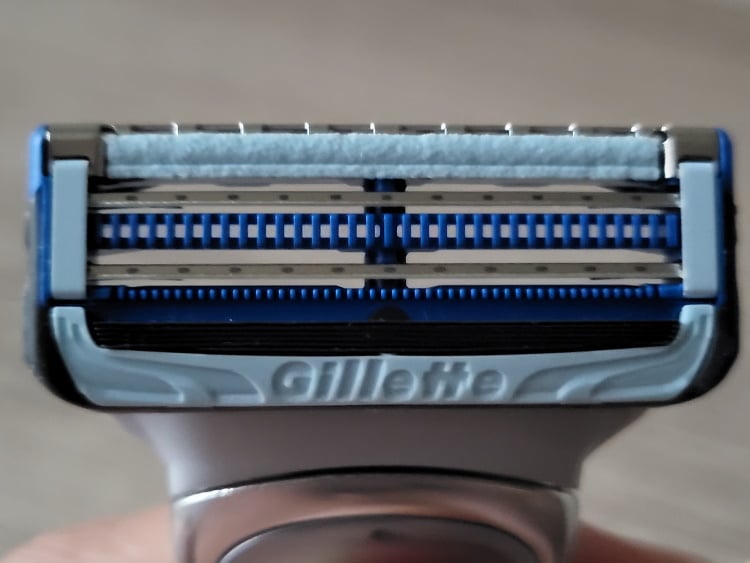close up of Gillette SkinGuard razor and protection plus lubrication strips