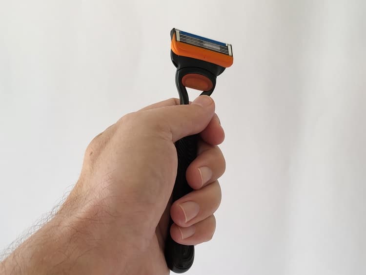 holding the Gillette Fusion5 razor in my hand to show its ergonomics