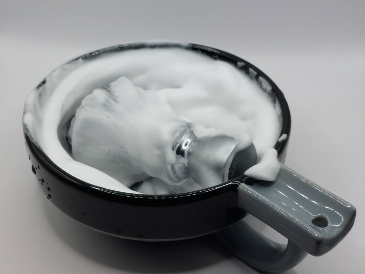 RazoRock XXX Shaving Soap lathered in shaving bowl with shaving brush