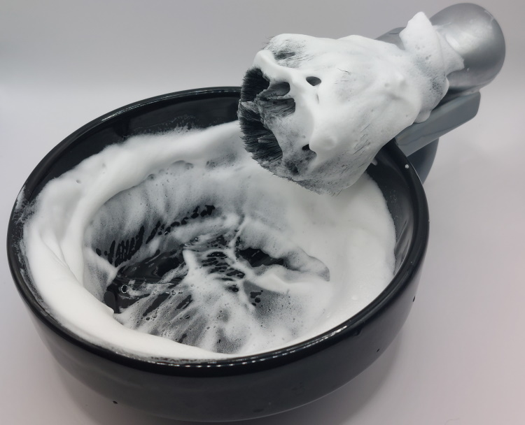 stirling shaving soap lathered in a black shaving bowl
