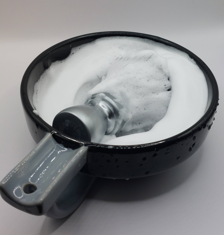 Cella Milano Almond lathered inside a shaving bowl with shaving brush