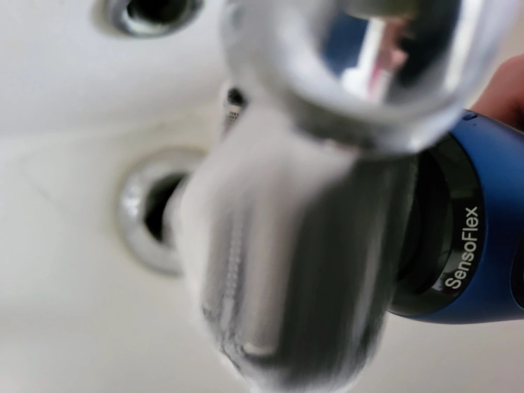 close up of cleaning the Braun Series 6 under the tap with water