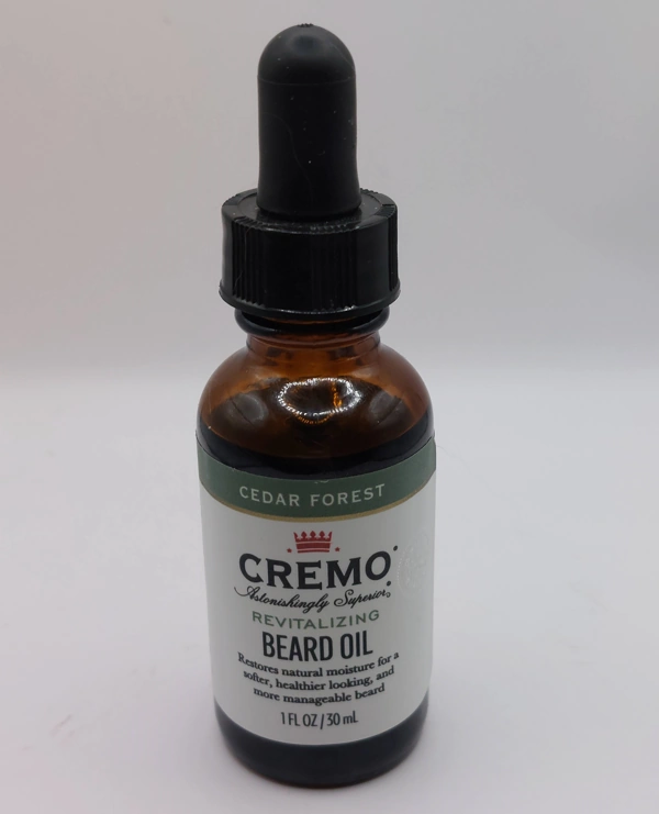 bottle of Cremo Revitalizing Cedar Forest Beard Oil new and ready to use