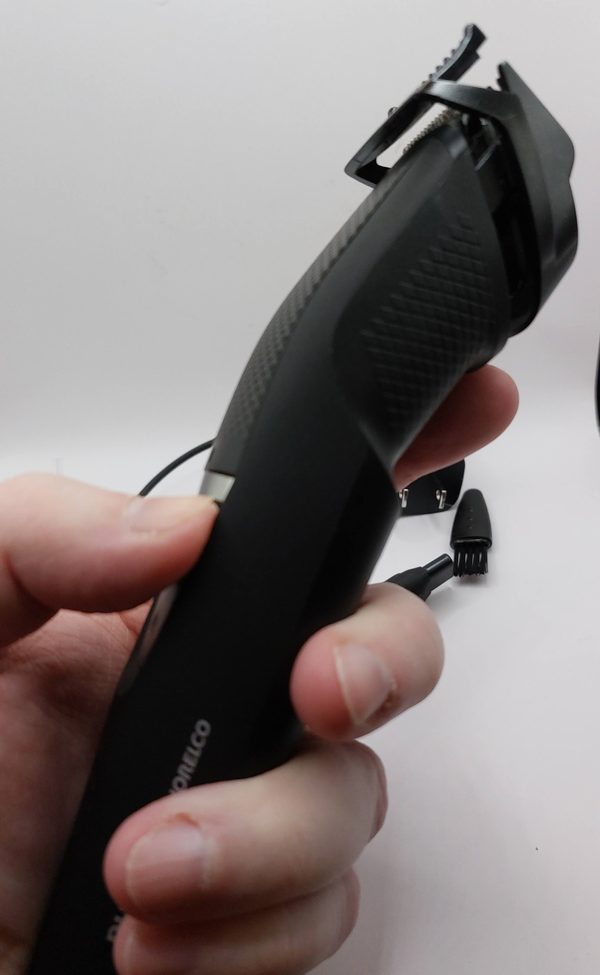 Philips Norelco Series 3000 beard and stubble trimmer held in the hand ready to use