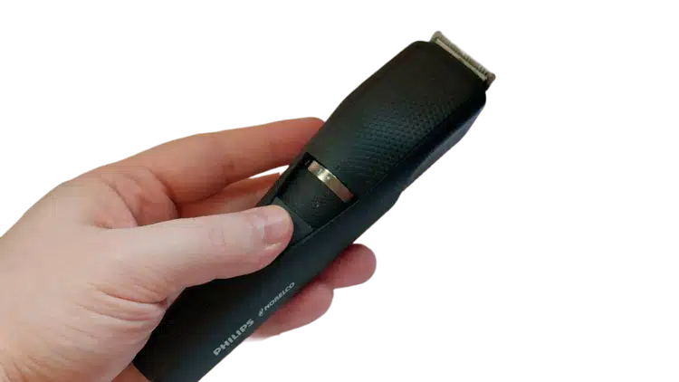Philips Norelco Series 3000 beard trimmer held in the hand on white background