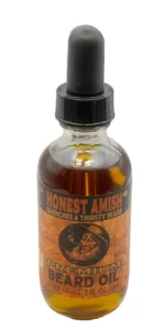 bottle of Honest Amish Premium Beard Oil on white background