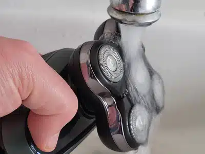 cleaning the Remington RX7 Head Shaver under the tap