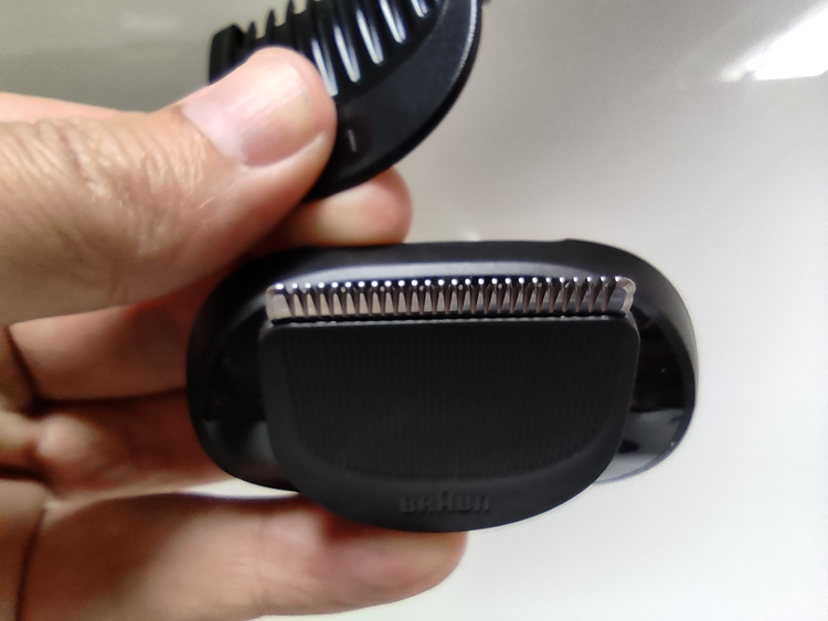 close up of Braun Series 7 trimmer section with beard trimmer attachment