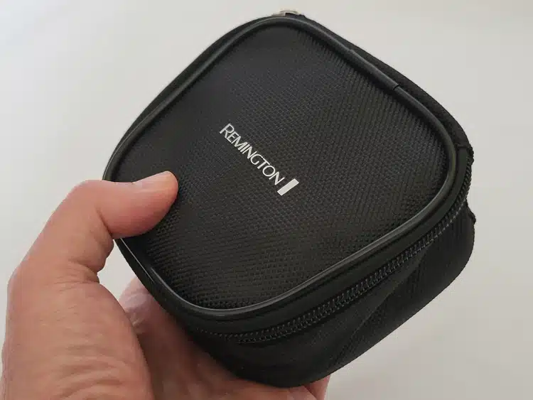 close up of Remington RX7 Head Shaver fabric travel case with shaver inside