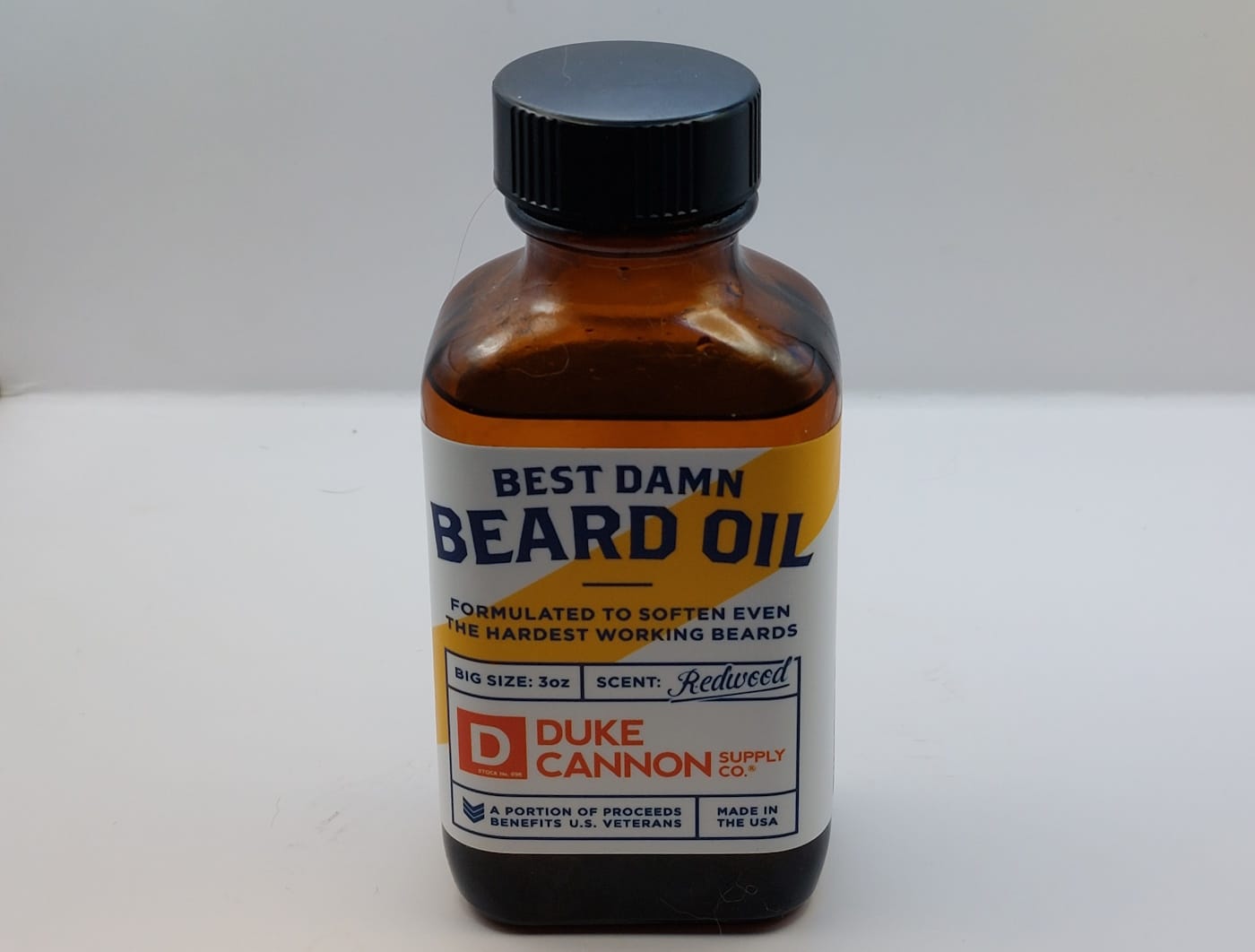 close up of Best Damn Beard Oil bottle unopened