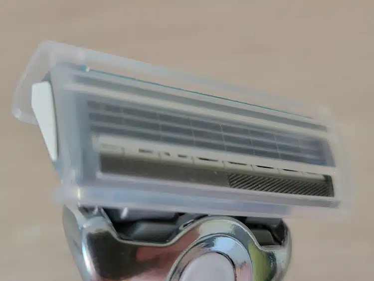 close up of the Schick Quattro Titanium Razor with plastic cover on the blade