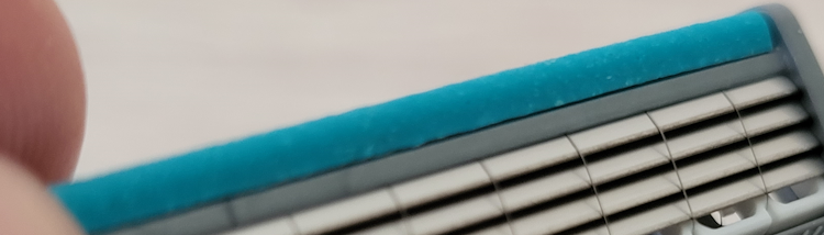 close up of the Schick Quattro Titanium blue lubrication strip