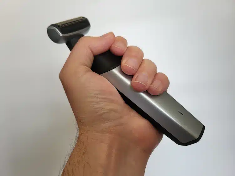 holding the Philips Norelco Bodygroom 5000 Series in the hand to highlight its ergonomics