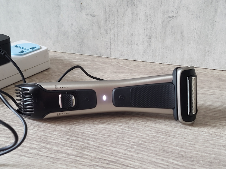 charging the Philips Norelco Bodygroom 7000 Series and showing LED charging light lit up