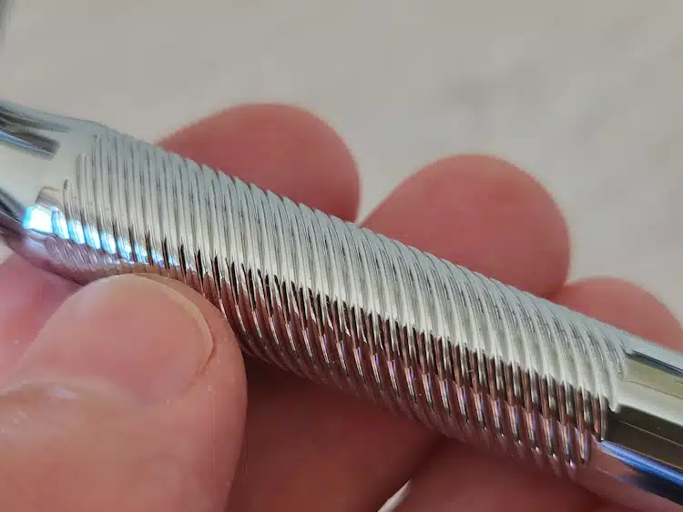 close up of King C. Gillette razor handle displaying how the engraved grip looks