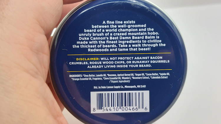 back of Best Damn Beard Balm tin showing the ingredients and writing