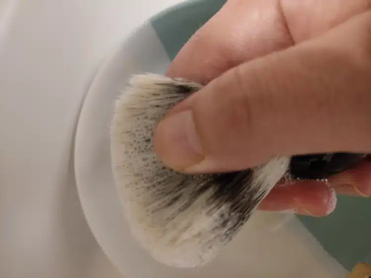 massaging soap into shaving brush bristles