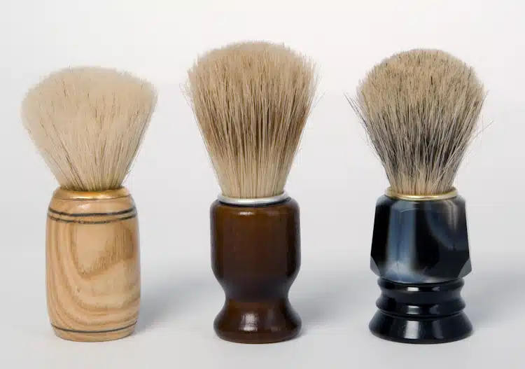 three shaving brushes showing different types of handles