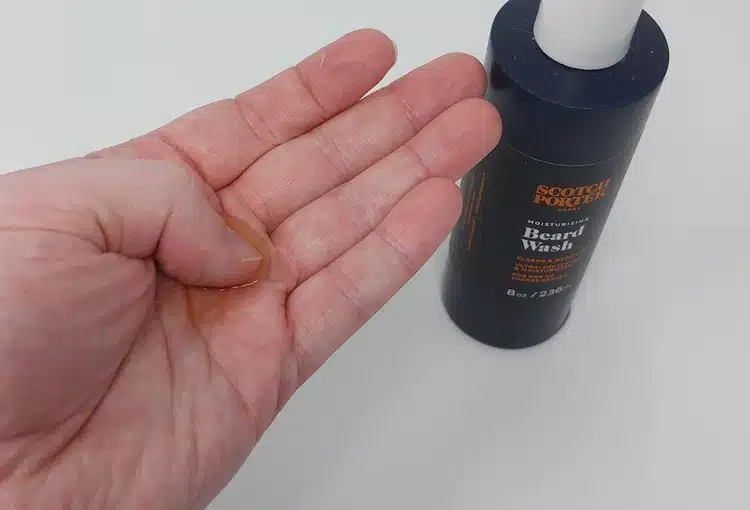 demonstrating how much Scotch Porter Moisturizing Beard Wash to place on the hand