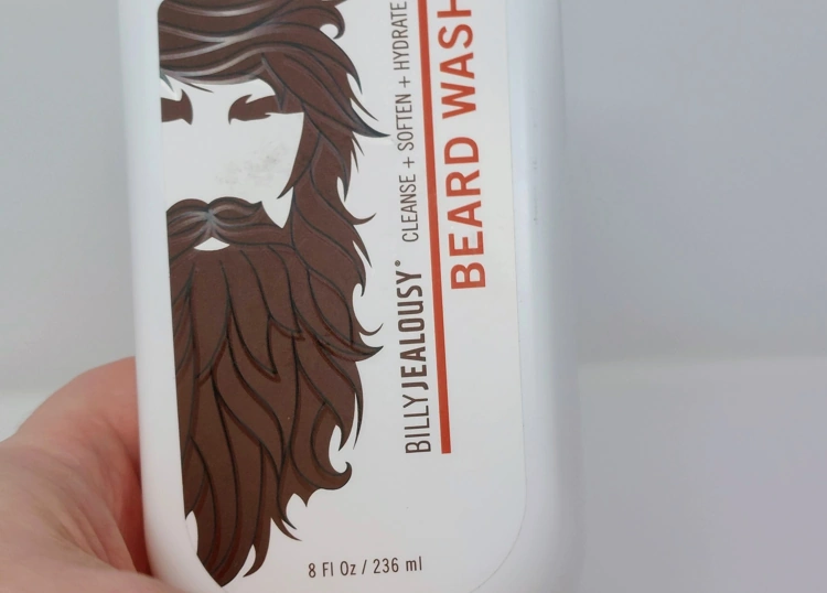 Billy Jealousy Beard Wash bottle held in hand showing the front section