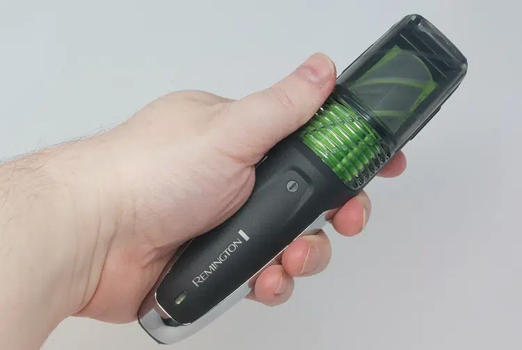 Remington Vacuum Beard and Stubble Trimmer held in the hand to display how it looks