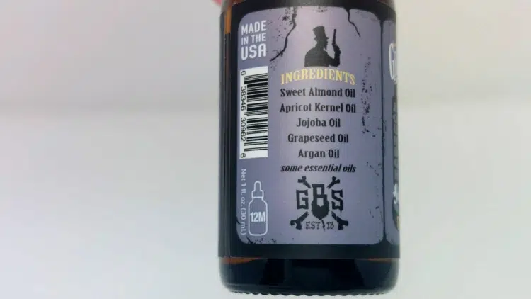 close up of Grave Before Shave Beard Oil ingredients on the back of the bottle