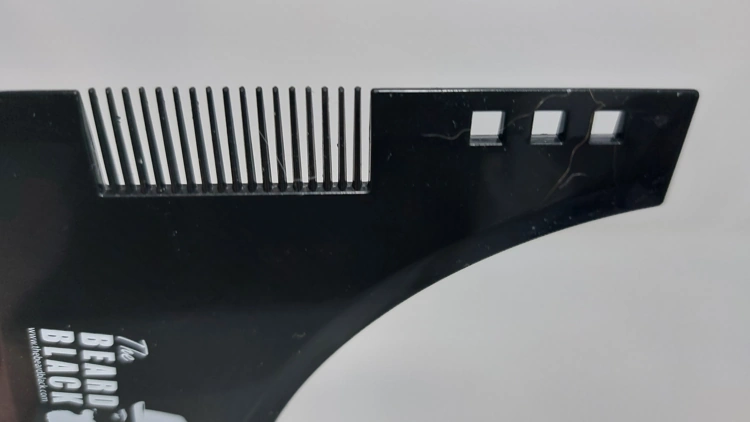 close up of The BEARD BLACK Beard Shaping Tool comb section