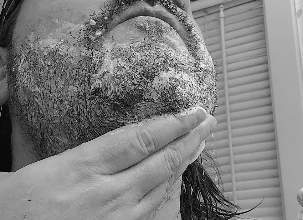 close up of reviewer Robert using the Professor Fuzzworthy's Beard Shampoo