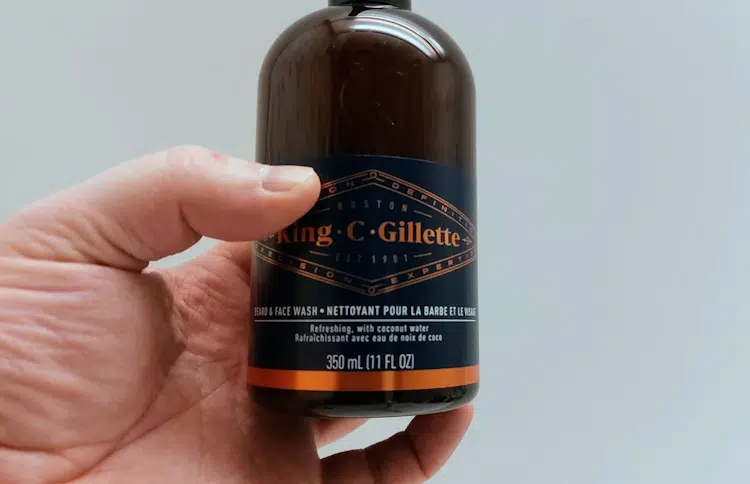King C. Gillette Beard & Face Wash bottle held to show the front label