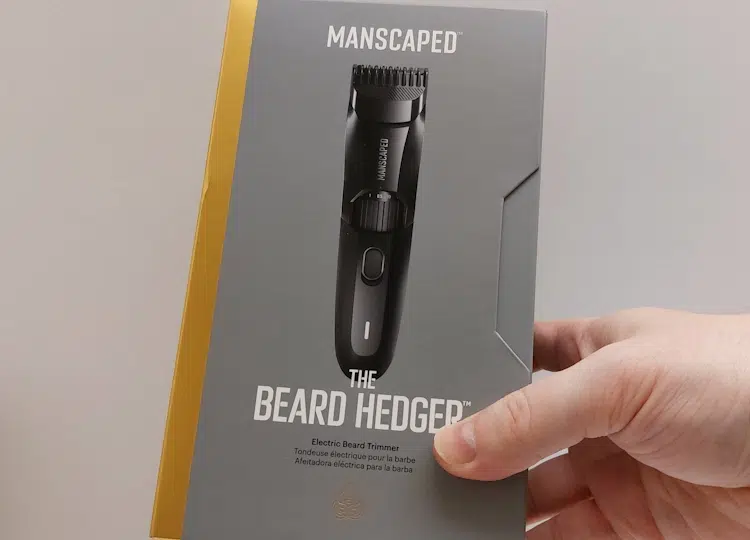 Manscaped The Beard Hedger held in hand in its box