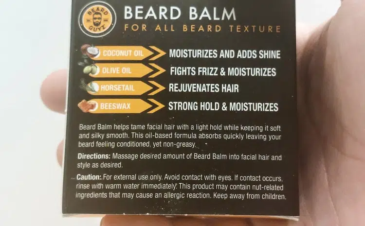 close up holding the Beard Guyz Beard Balm and showing the back section