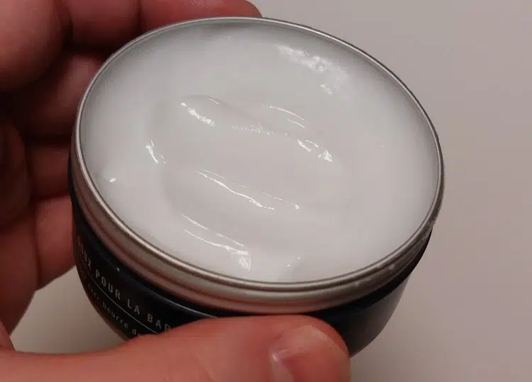 a tub of King C Gillette Soft Beard Balm with its lid off showing the balm