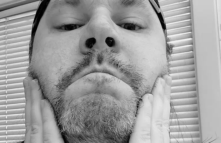 reviewer Robert rubbing King C Gillette Soft Beard Balm into his beard