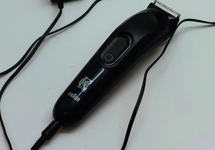 the King a C Gillette Beard Trimmer attached to power cord