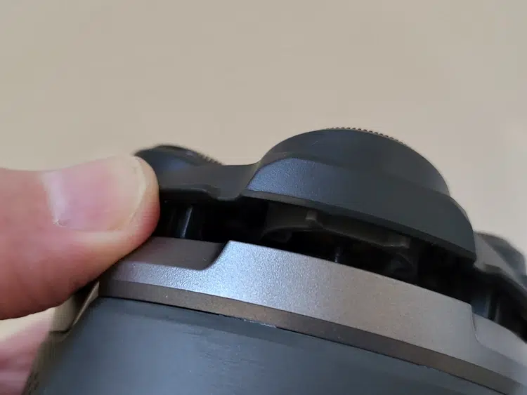 close up of detaching the Microtouch Titanium Head Shaver blade head