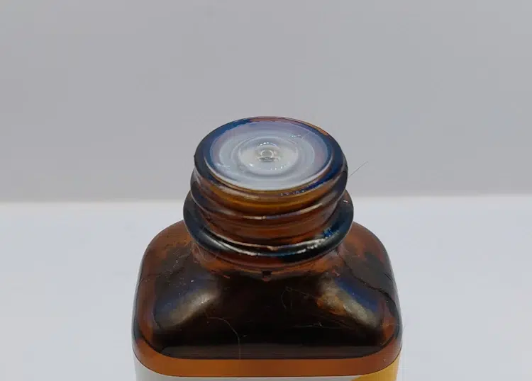 plastic top of beard oil bottle