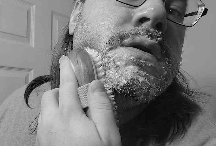 brushing Suavecito Beard Wash on the beard