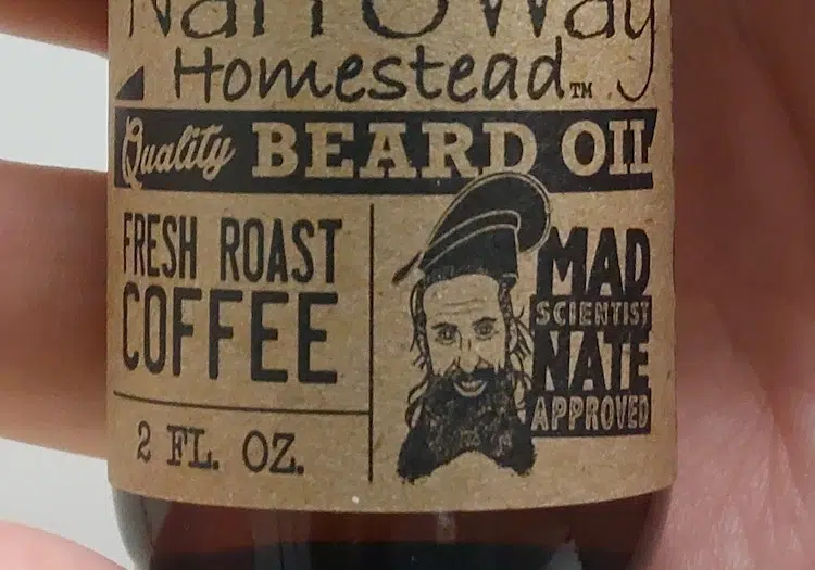 close up of Narroway Beard Oil label stating fresh roast coffee