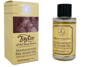 Taylor of Old Bond Street Sandalwood Pre-Shave Oil bottle next to its box on white background